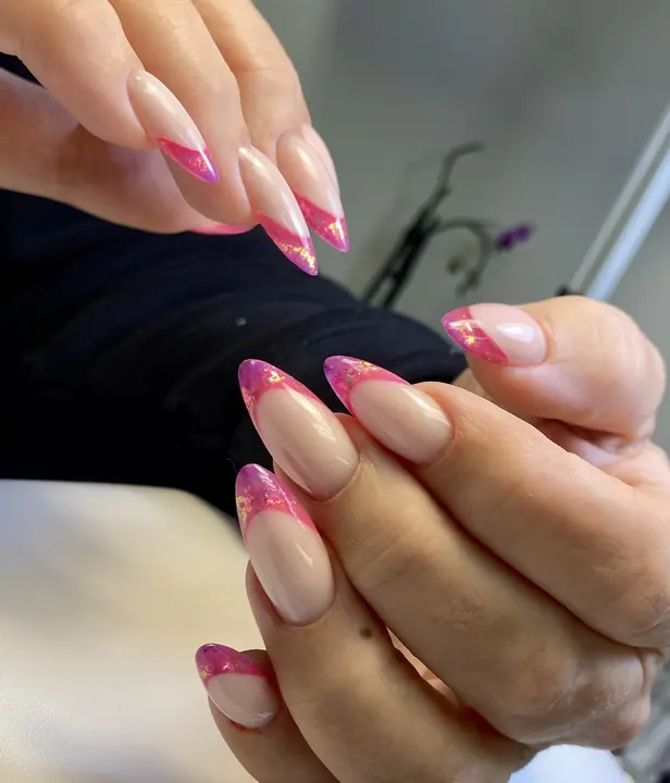 Pink French tips on long almond extensions
