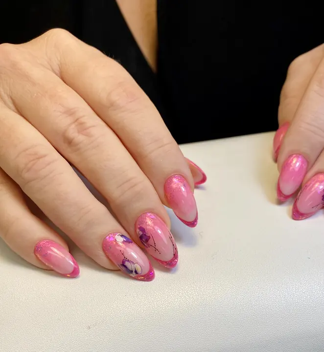 Pink floral nail art on almond nails