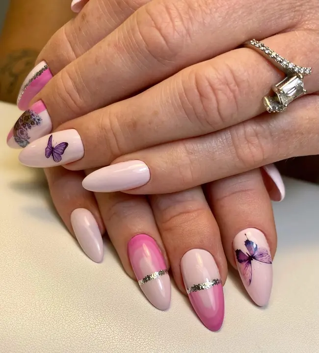 Blush almond nails with butterfly and silver details