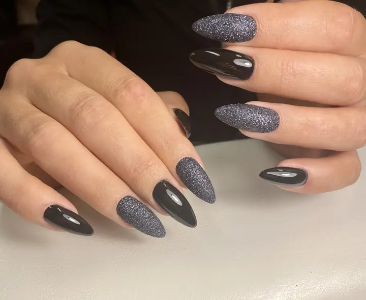 Black and glitter gel on almond nails