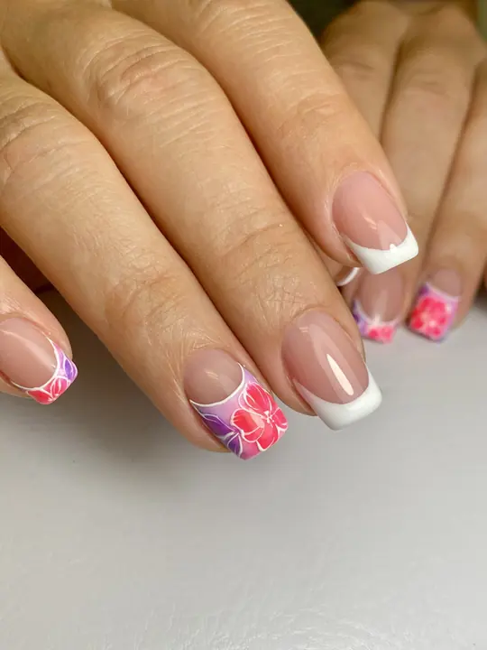 French manicure with painted hibiscus accents
