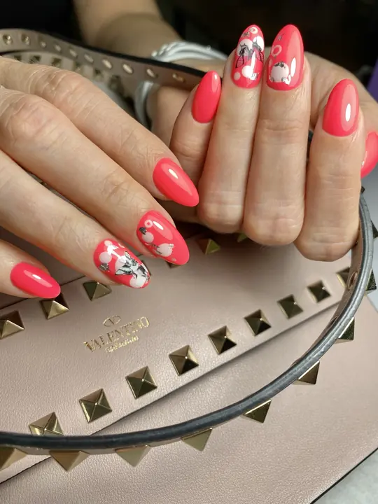 Coral almond nails with white floral details