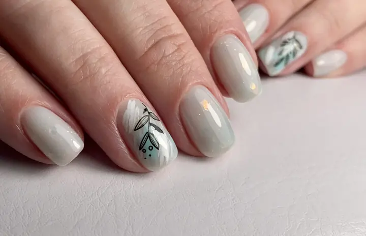 Grey manicure with fine botanical line art