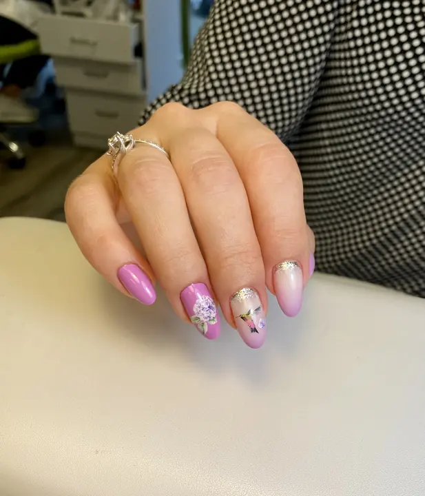 Pink almond nails with violet flower art