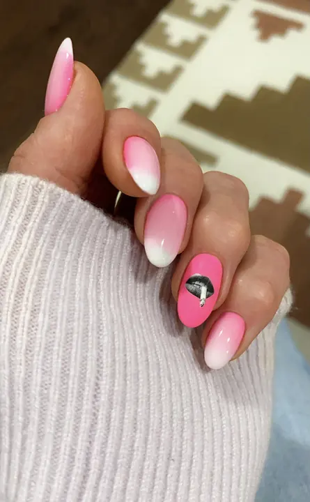 Pink ombre almond nails with a heart accent