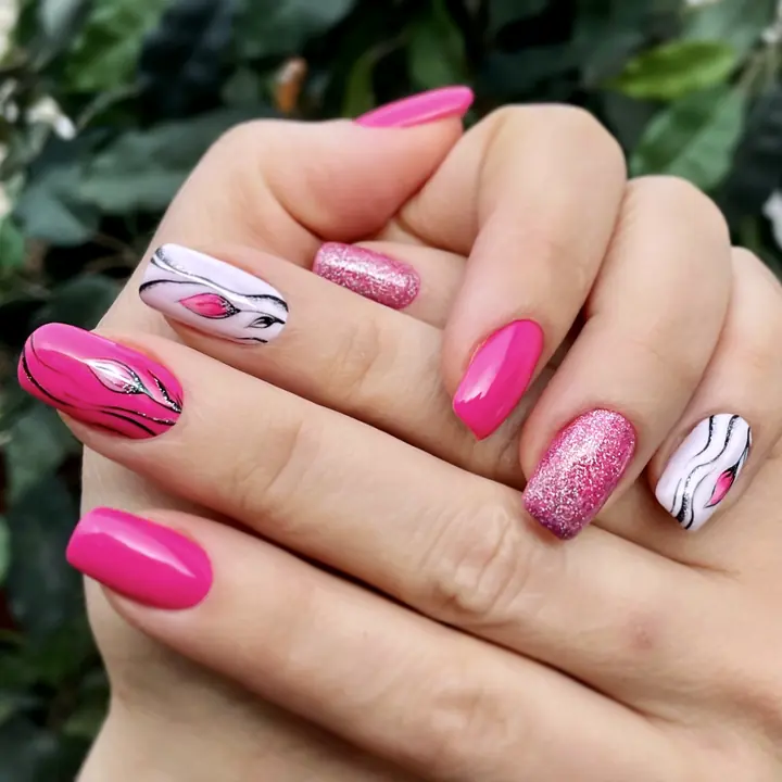 Hot pink manicure with graphic line art and glitter
