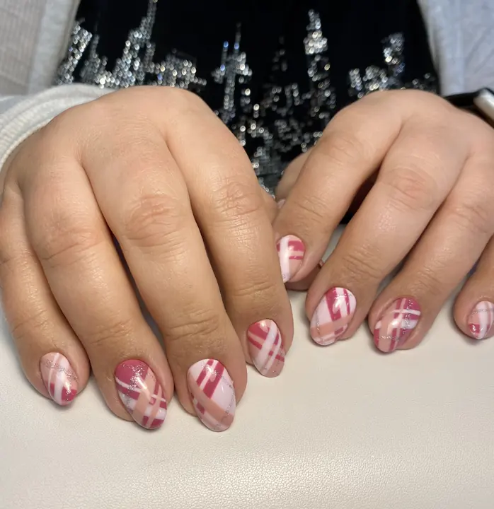 Pink and white plaid nail design