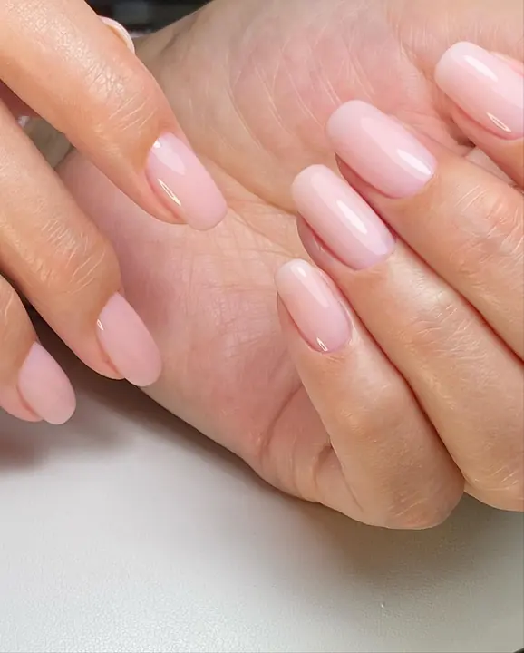 Sheer pink gel manicure on short nails