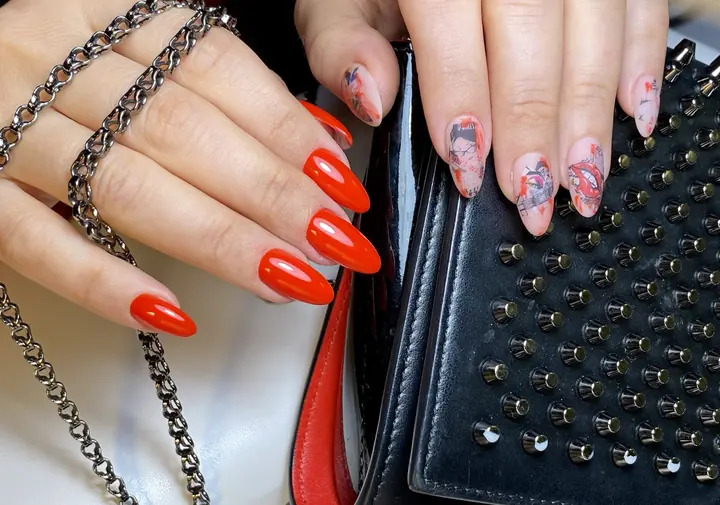 Red almond nails with marble accent nails