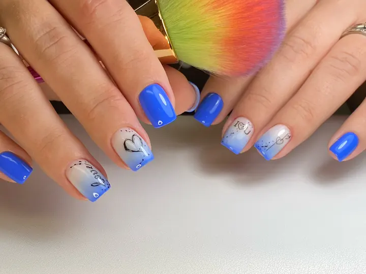 Cobalt blue manicure with ombre heart accent
