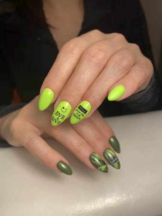 Neon green and olive almond nails with lettering