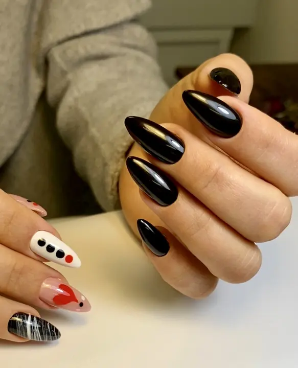 Black almond nails with red heart and dot art