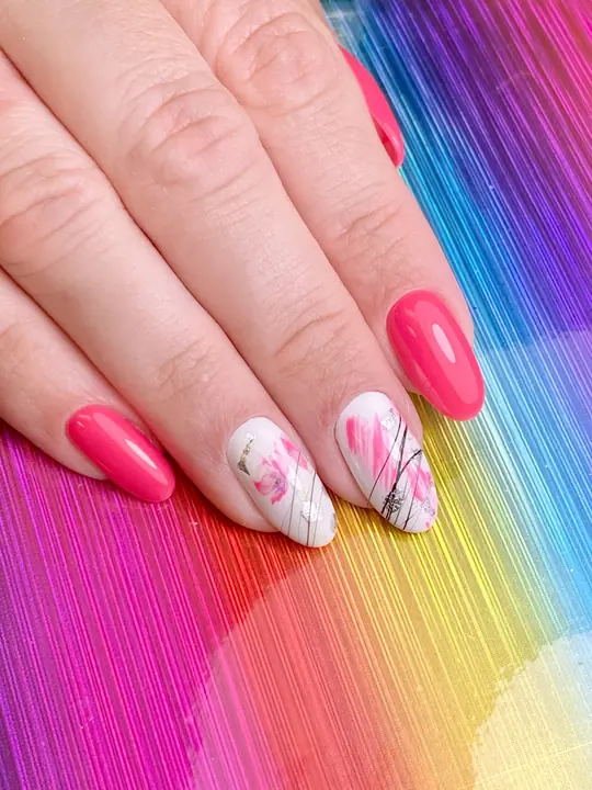 Pink manicure with marble accent nails